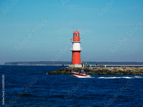 The red lighthouse at the harbor entrance