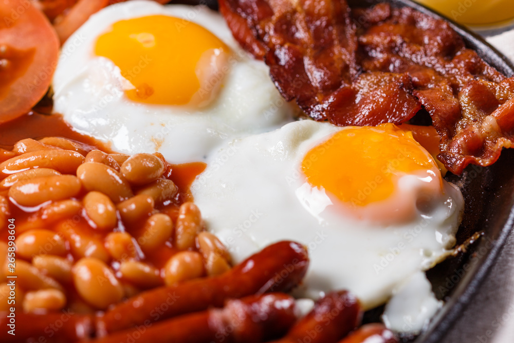 delicious English breakfast on a dark rustic background delicious English breakfast on a dark rustic background