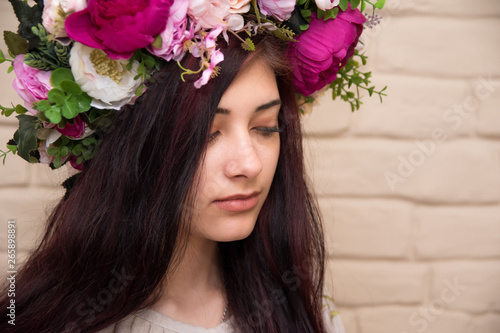 Portrait of a girl with a corolla on her head. Wreath - Traditional Ukrainian headdress of girls.