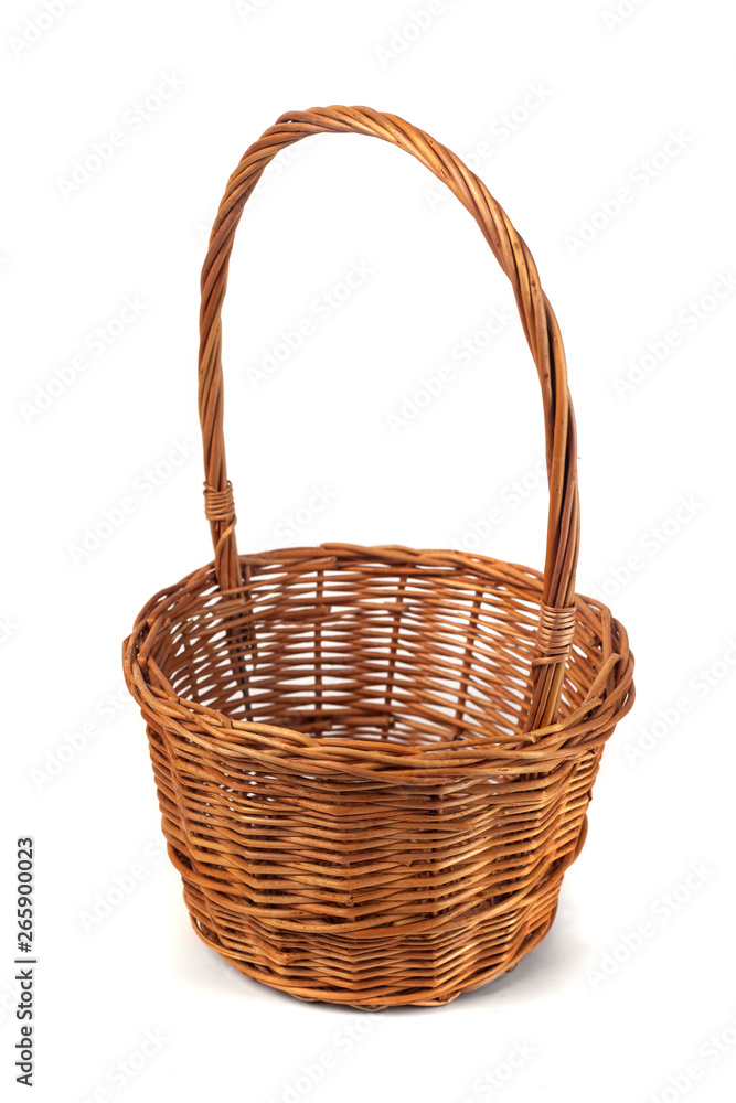 Empty wicker basket for fruits and vegetables isolated on white