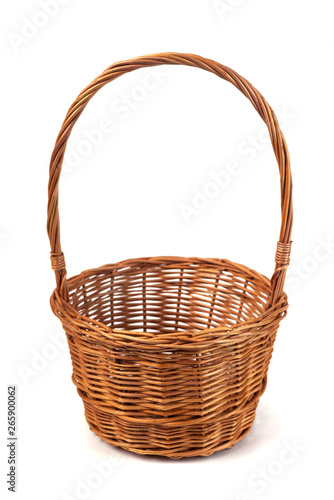 Empty wicker basket for fruits and vegetables isolated on white