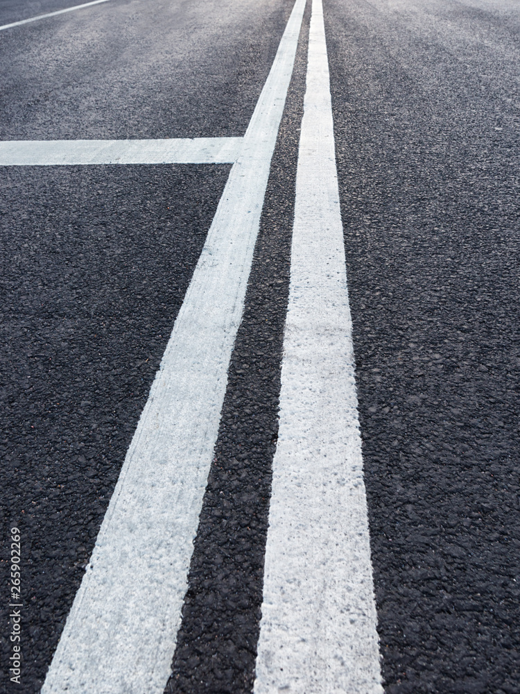 Road with white marking diminishing perspective