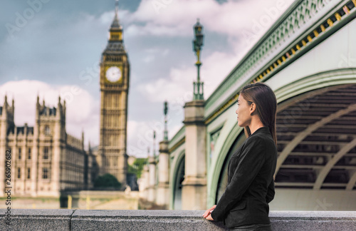 Photography London business people city lifestyle young businesswoman looking at Parliament Big Ben clock tower, UK