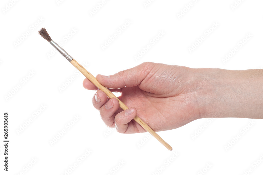 Male hand holding a brush on a white background. Male hand holding a brush on a white background.