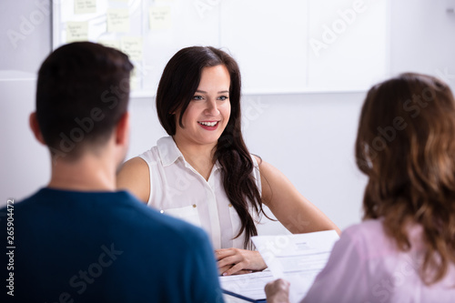 Businesspeople Taking Interview Of Woman
