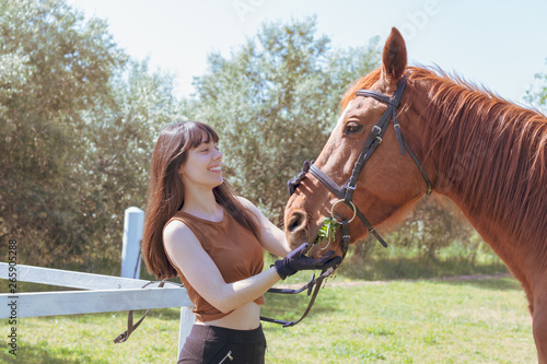 female rider cares for her horse