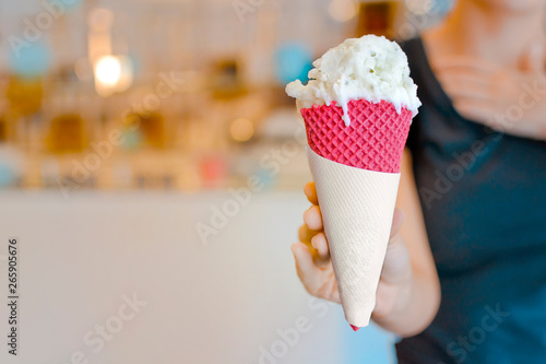 Green ice cream cone with lime and basil flavor photo