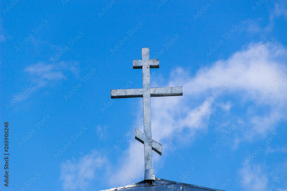 Orthodox Christianity. Jesus. Easter. a gold dome with a cross against the sky. Orthodox cross in the blue sky. Christianity. Religion.