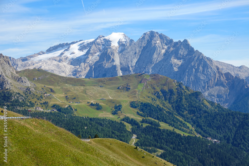 AERIAL: Flying high above the empty grassfields and towards the snowy peaks.