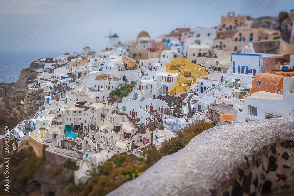 Tilt shift effect of the village of Oia on a cloudy day