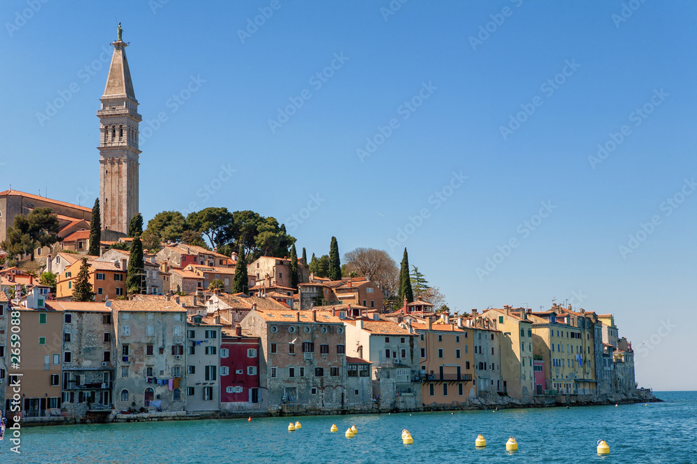 Beautiful and romantic croatian town Rovinj with the St. Euphemia church’s tower and the sea