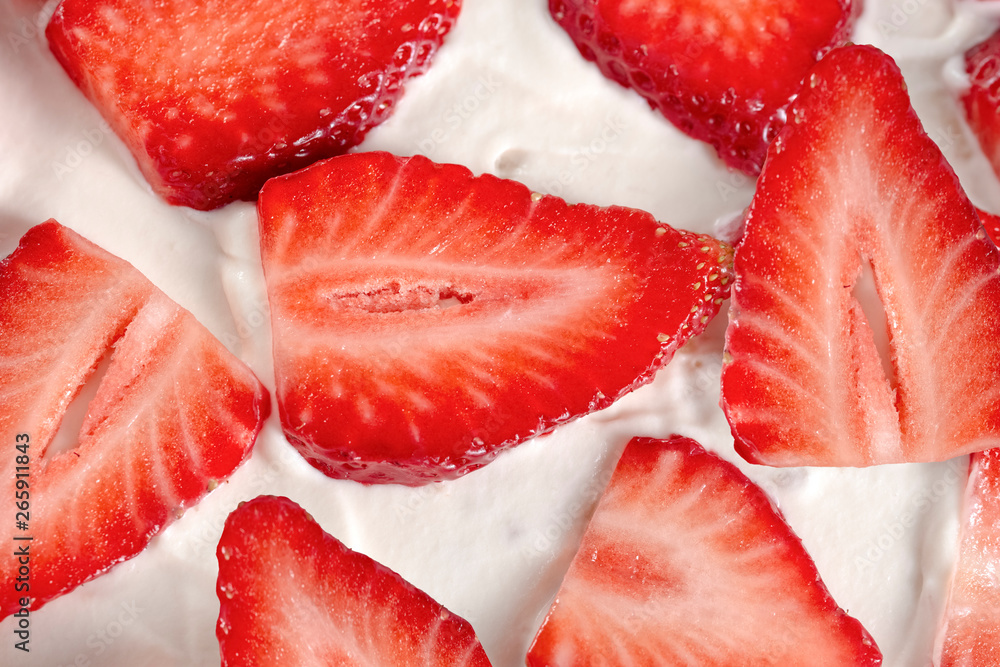 Red fresh strawberries in white milk cream closeup. Red fresh strawberries in white milk cream closeup.