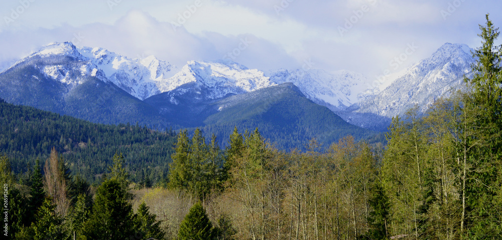 View of Snowy, Cloud strewn Olympic Mountains, Port Angeles, Washington