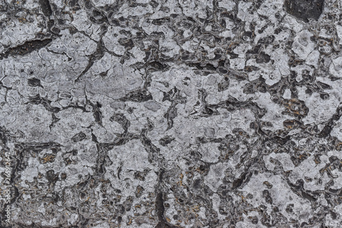 Grunge grey concrete wall with crack and stains in industrial building. Cement texture for design and background.
