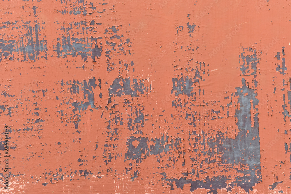 Peeling red paint on metal texture background