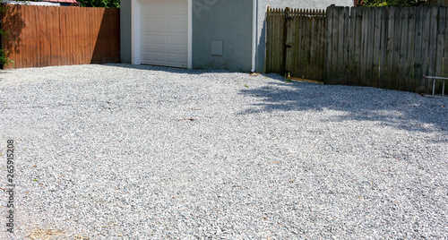 New gravel driveway in rear of residential home. photo