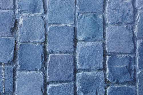 Stone pavement texture.  Old cobblestone abstract background. Close up.