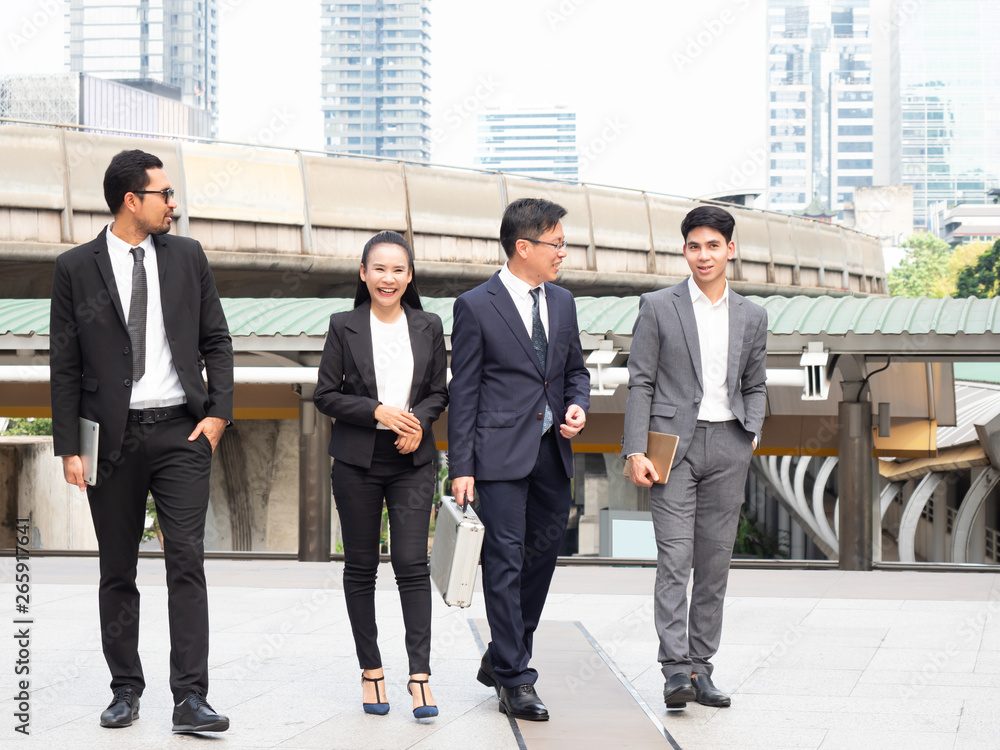 Happy business team are walking on street in the city. Asian business teamwork. Happy business team are walking on street in the city. Asian business teamwork.