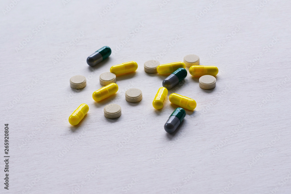 Pills, tablets and capsules on a white background. The concept of medicine, pharmacy and health care Pills, tablets and capsules on a white background. The concept of medicine, pharmacy and health care