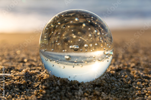 glass ball on the beach