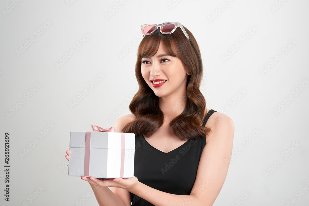 young attractive asian woman having a present young attractive asian woman having a present