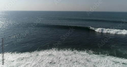 Surfer riding wave in tropical beach. Young man surfing long wave.