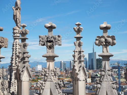 Milano, Italy. Panorama of the city and the skyscraper from the roof terrace of the cathedral. The white marble spires of the Duomo