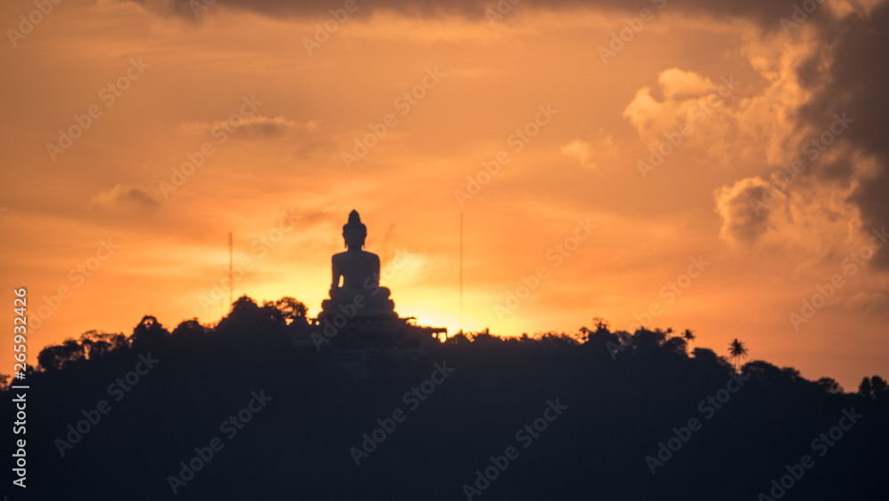 Beautiful Silhouette Sunset Scene of Big Buddha Statue on Hilltop Mountain Famous Viewpoint with Colourful Sky in Phuket - THAILAND