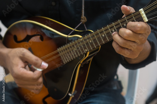 Musician playing ukulele.