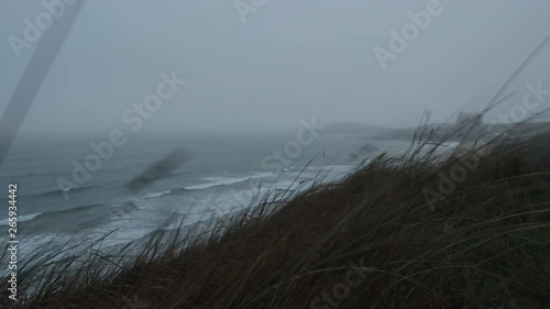 heavy wind and sea mist on an Autumn day at Fistral Beach, Newquay, Cornwall, England.