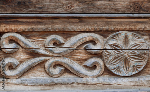 The texture of a tree emphasized in an ancient Russian pattern, which was repeatedly treated to destructive action of the natural phenomena and time. Ready photo background. Macro.