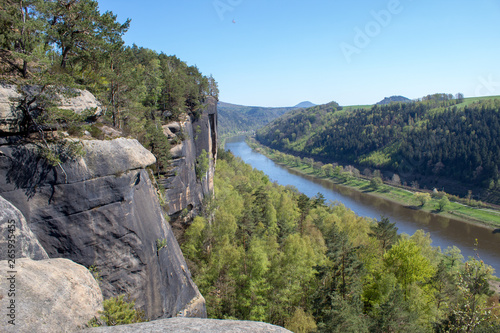 Saxon Switzerland - Germany main attraction. View from Bastei in view of a German town, sandy cliffs and the river Elbe on a sunny spring day