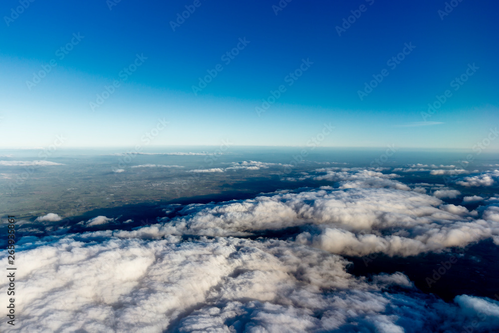 Flying above the clouds, view from the airplane, New Zealand