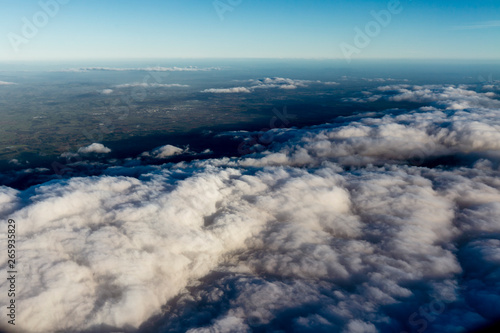 Flying above the clouds  view from the airplane  New Zealand