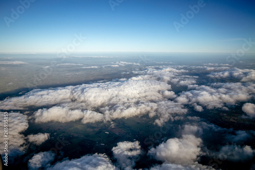 Flying above the clouds  view from the airplane  New Zealand