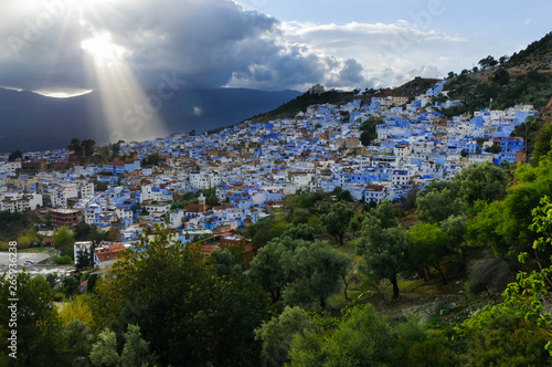 The blue city Chefchaouen/City view of the blue city Chefchaouen with dramatic sky, Morocco, Africa.