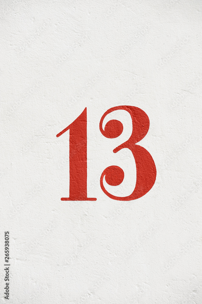 Number thirteen on white wall, Germany, Europe Number thirteen on white wall, Germany, Europe