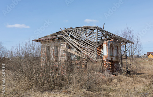 The old buildings built of a brick, destroyed by time and the nature at the beginning of spring in sunny day. Russian remote place. © Елена Круглова