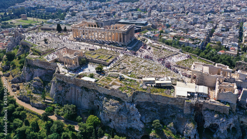 Aerial drone bird's eye view photo of iconic Acropolis hill, the Parthenon, Athens historic center, Attica, Greece