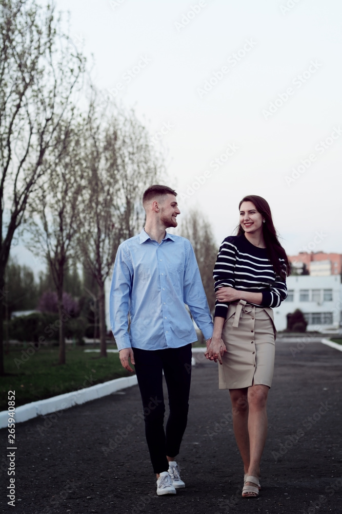 Fototapeta premium Beautiful coule walking outdoors