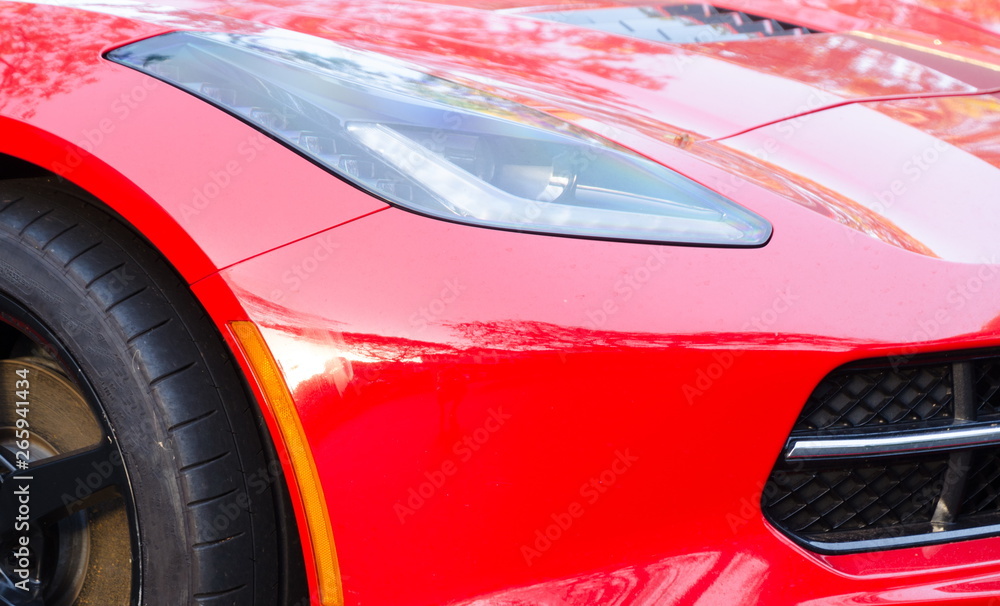 Details of exterior of sport red car at expo Details of exterior of sport red car at expo