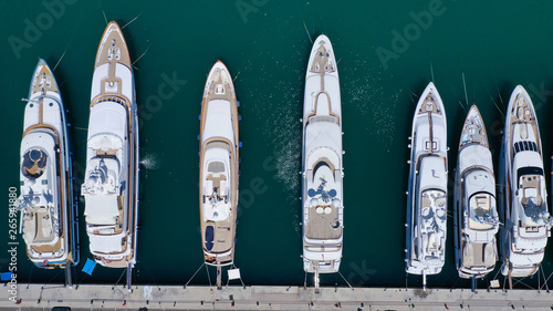 Aerial drone top view photo of luxury yachts docked in mediterranean port