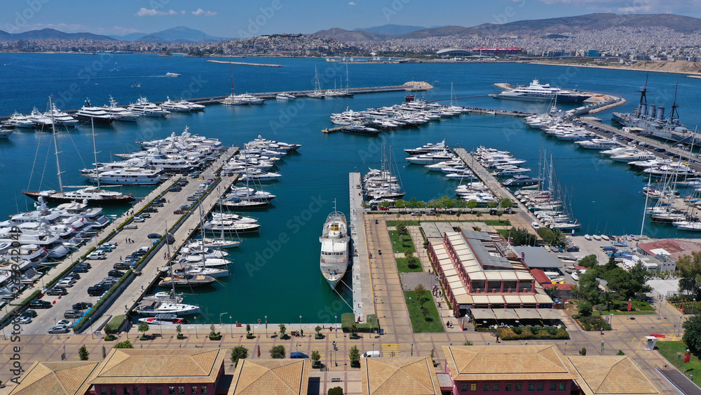Fototapeta premium Aerial drone panoramic photo of famous Flisvos Marina with mega yachts and sail boats docked, Athens riviera, Attica, Greece