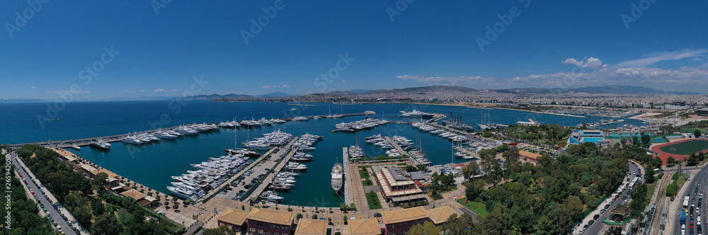 Aerial drone panoramic photo of famous Flisvos Marina with mega yachts and sail boats docked, Athens riviera, Attica, Greece