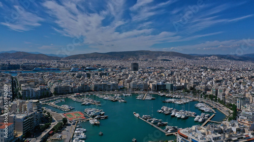 Aerial drone panoramic photo of iconic port of Marina Zeas or Pasalimani with yachts and sail boats docked and beautiful blue sky - clouds  port of Piraeus  Attica  Greece