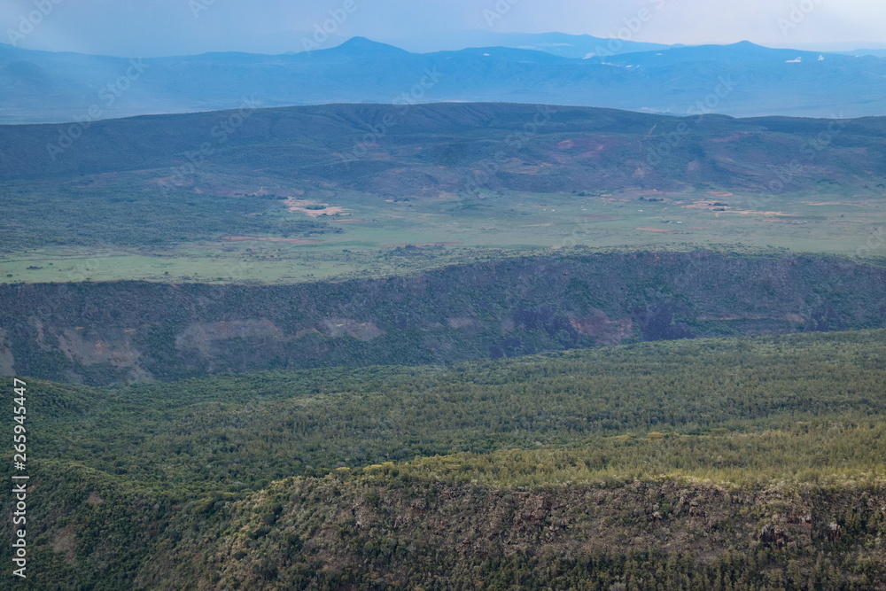 Volcanic crater against a mountain background, Mount Suswa, Kenya