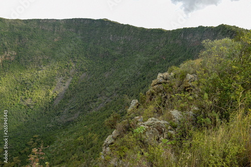 Volcanic crater against a mountain background, Mount Suswa, Kenya