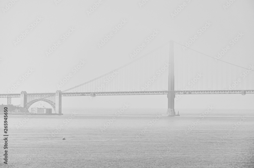 View of Golden Gate Bridge in San Francisco in a foggy morning.