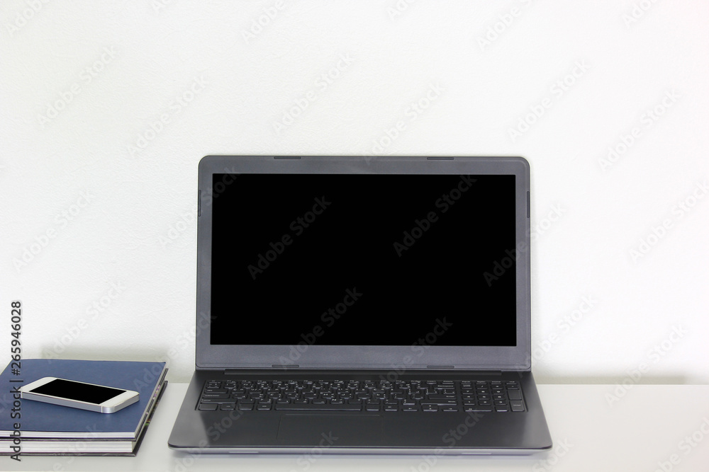 Conceptual workspace, Laptop and phone with blank screen isolated on white background Conceptual workspace, Laptop and phone with blank screen isolated on white background