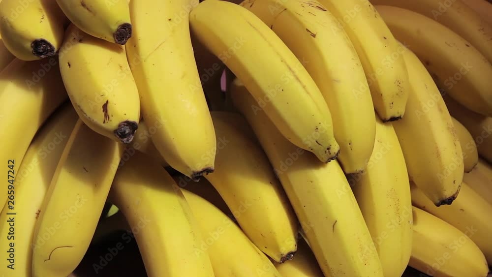 Many fresh bananas are sold in a supermarket Many fresh bananas are sold in a supermarket